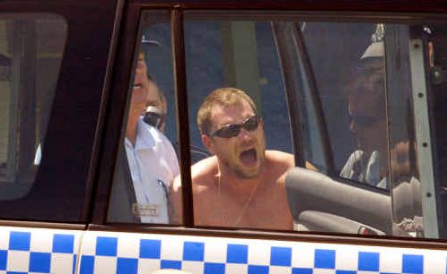 Joseph Readie is put into a police vehicle after he surrendered following an incident in Emu Park in 2009. Joseph Readie is put into a police vehicle after he surrendered following an incident in Emu Park in 2009.